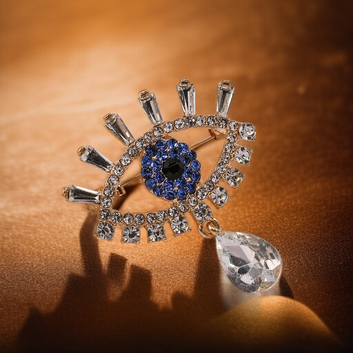 เข็มกลัดติดอกฝังเพชรลายดวงตาปีศาจ