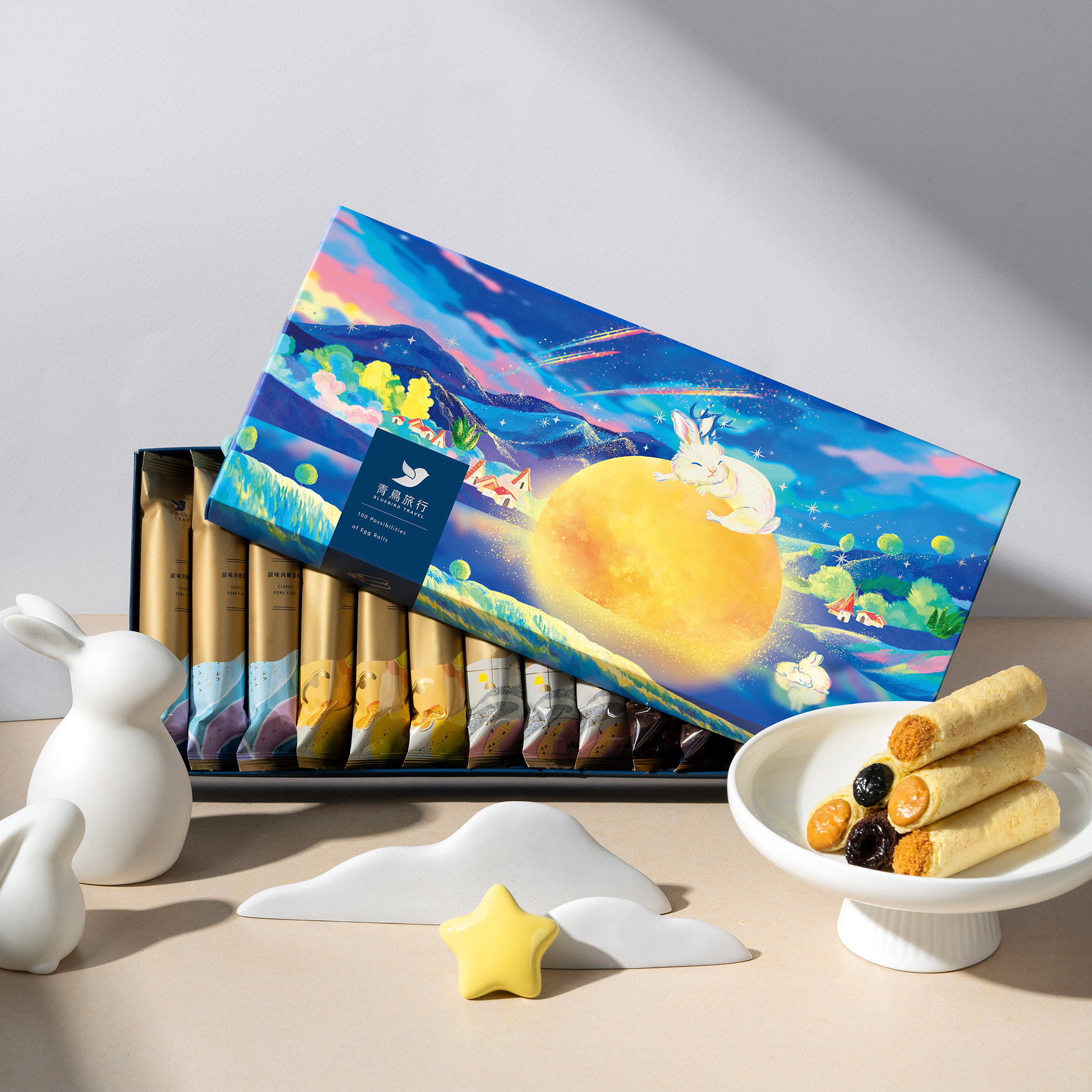 Moon rabbit gift box with classic filled egg rolls on a festive table.