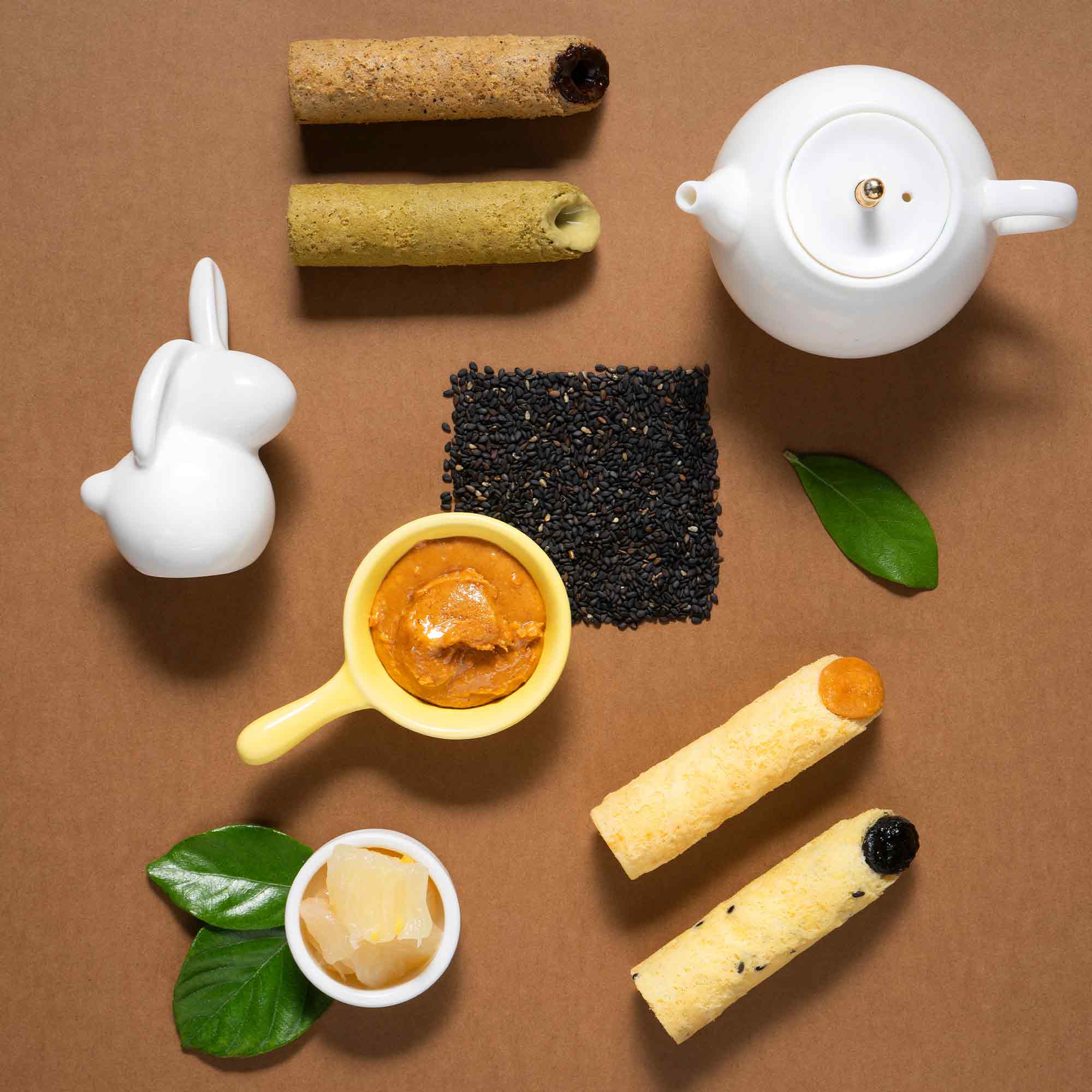 Tea and fruit filled egg rolls with sesame and peanut flavours.