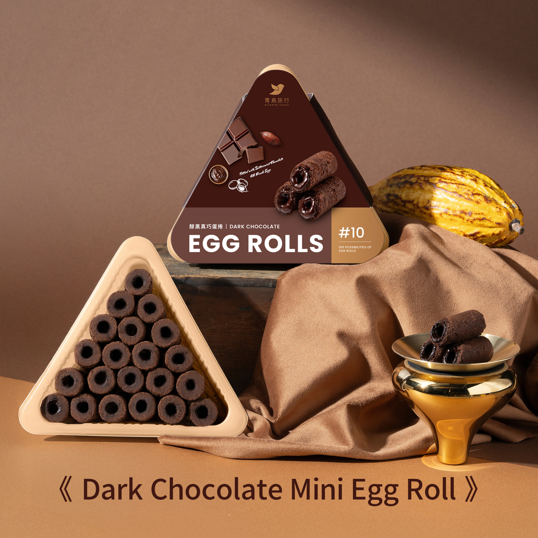 Dark chocolate mini egg rolls share box opened with bite-sized rolls arranged inside