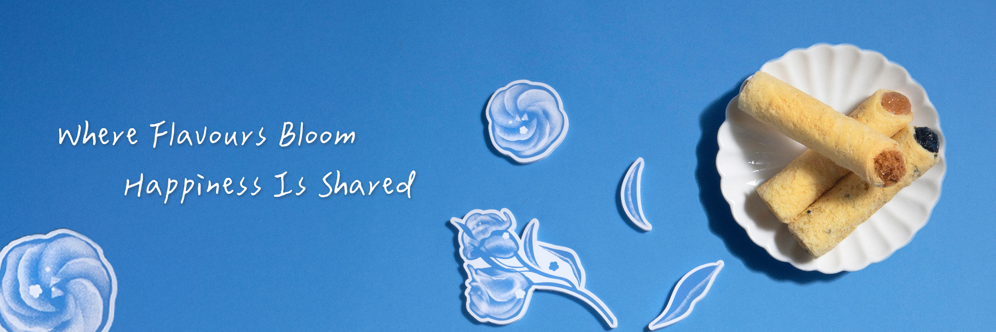 Bluebird Travel summer egg rolls on plate with Where Flavours Bloom Happiness Is Shared.