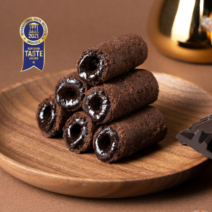 Close-up of dark chocolate filled mini egg rolls with rich chocolate centre