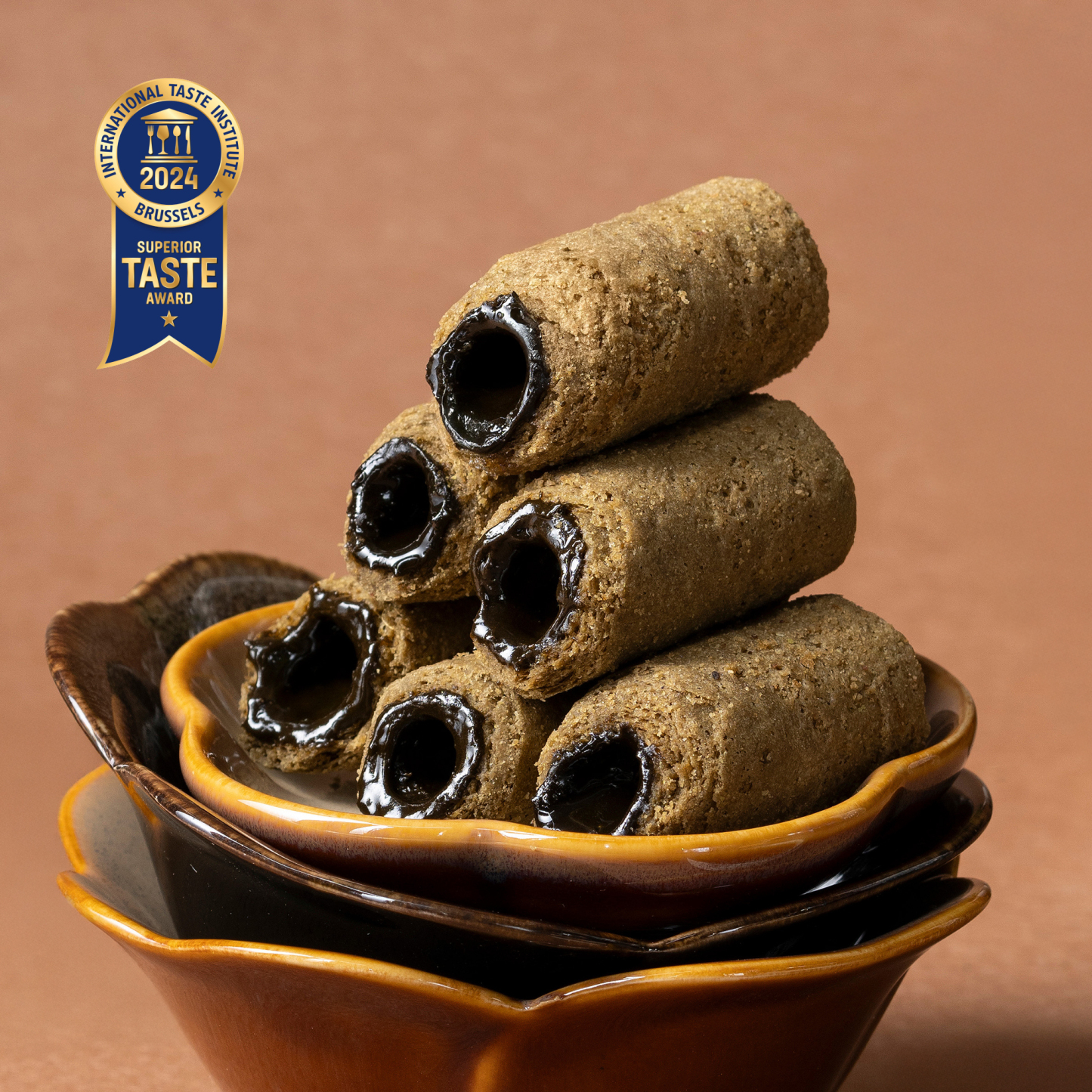 Close up of Tieguanyin tea chocolate filled mini egg rolls with superior taste award.