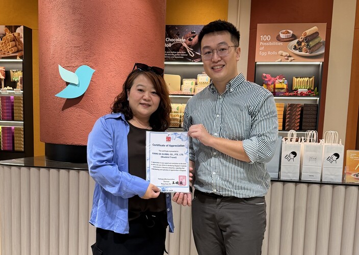 Receiving the Certificate of Appreciation.