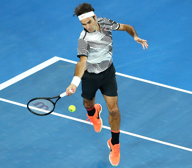 Roger Federer, mid game about to hit a ball