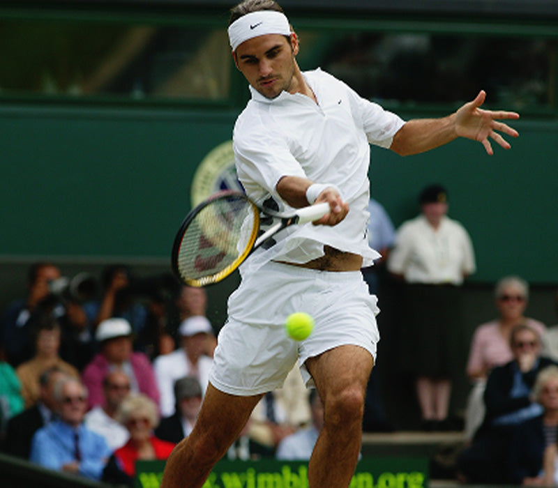 Roger Federer, earlier in his career, mid game about to hit a ball