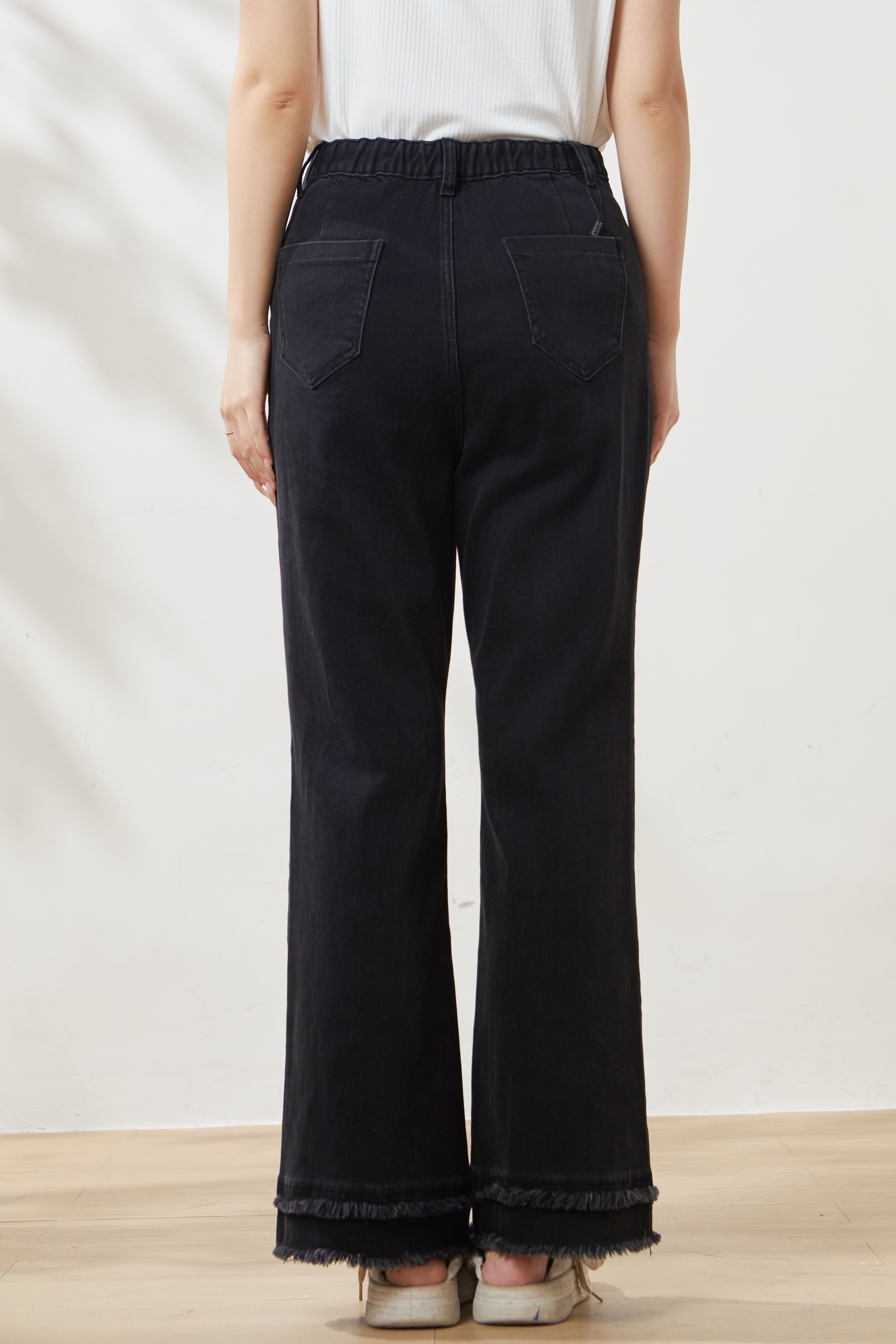 High-waisted flared jeans with frayed hem FCK6960