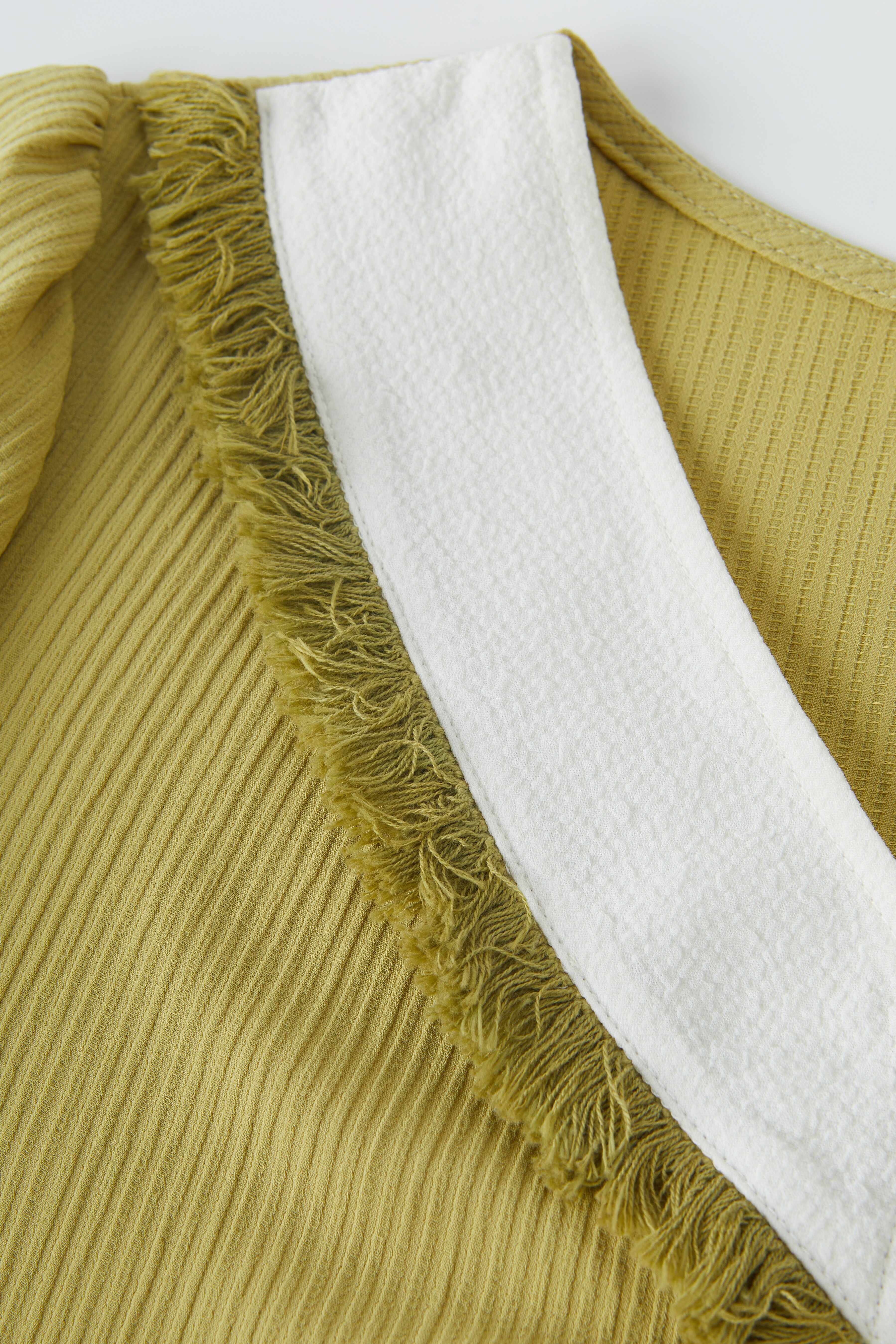 Color-Block Fake Two-Piece Patchwork Fringe Top EXA5035