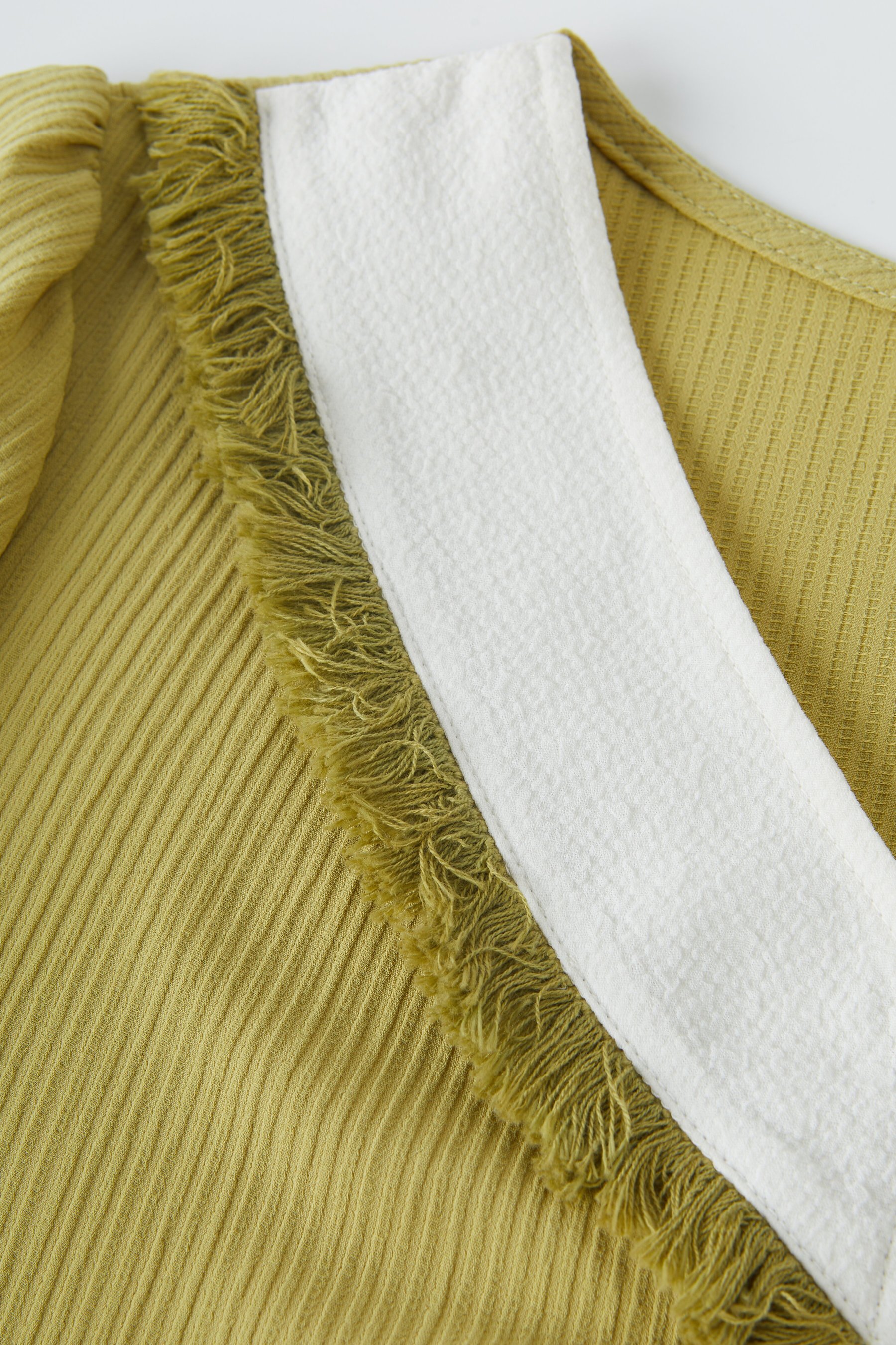 Color-Block Fake Two-Piece Patchwork Fringe Top EXA5035