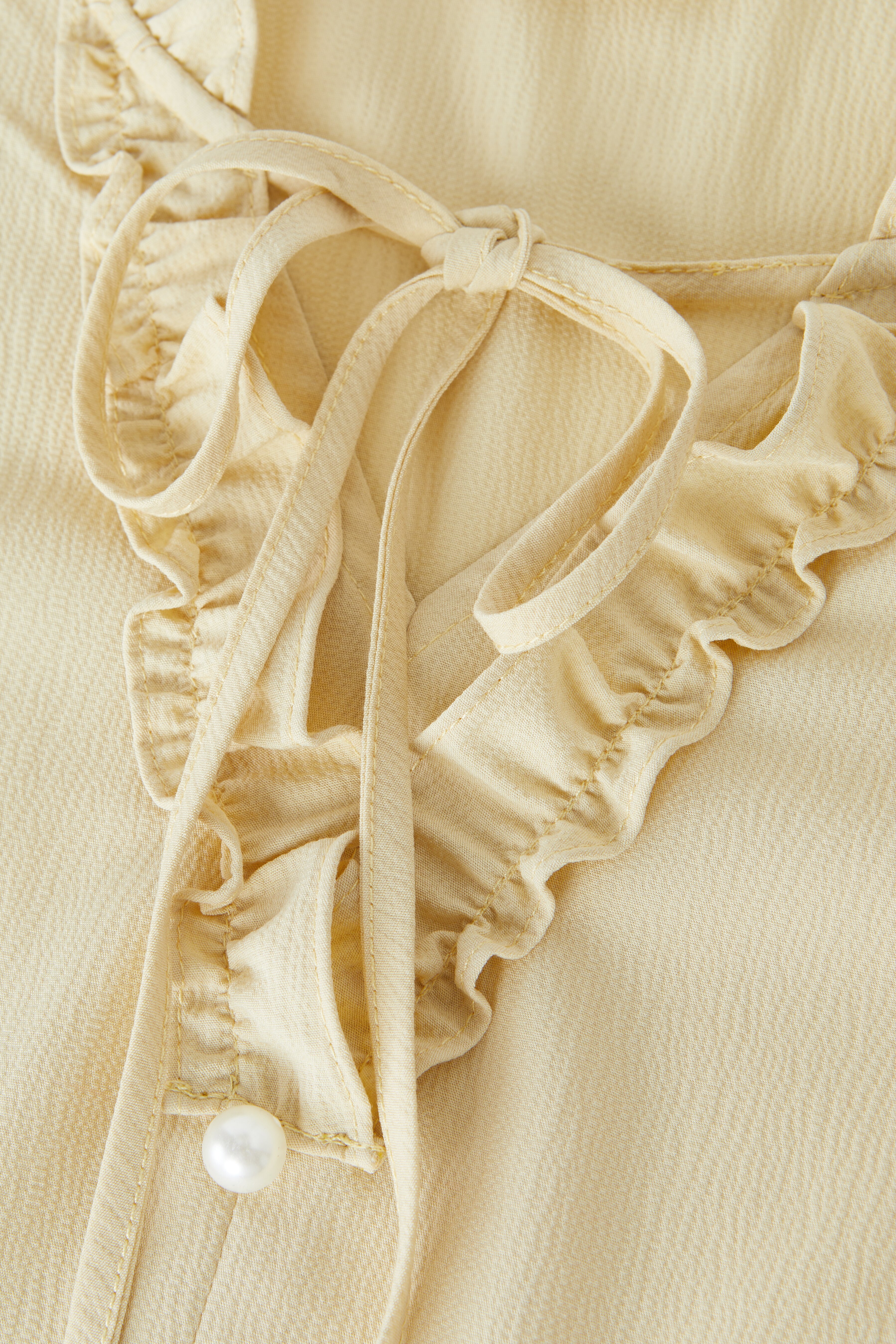 Ruffled Edge Tie Bubble Sleeve Blouse EXA5158