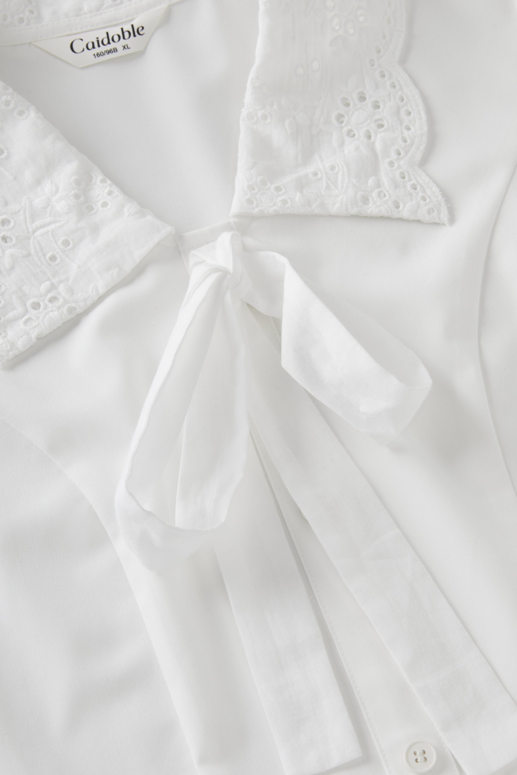 Waist-cinching heavy embroidery top FXA7058