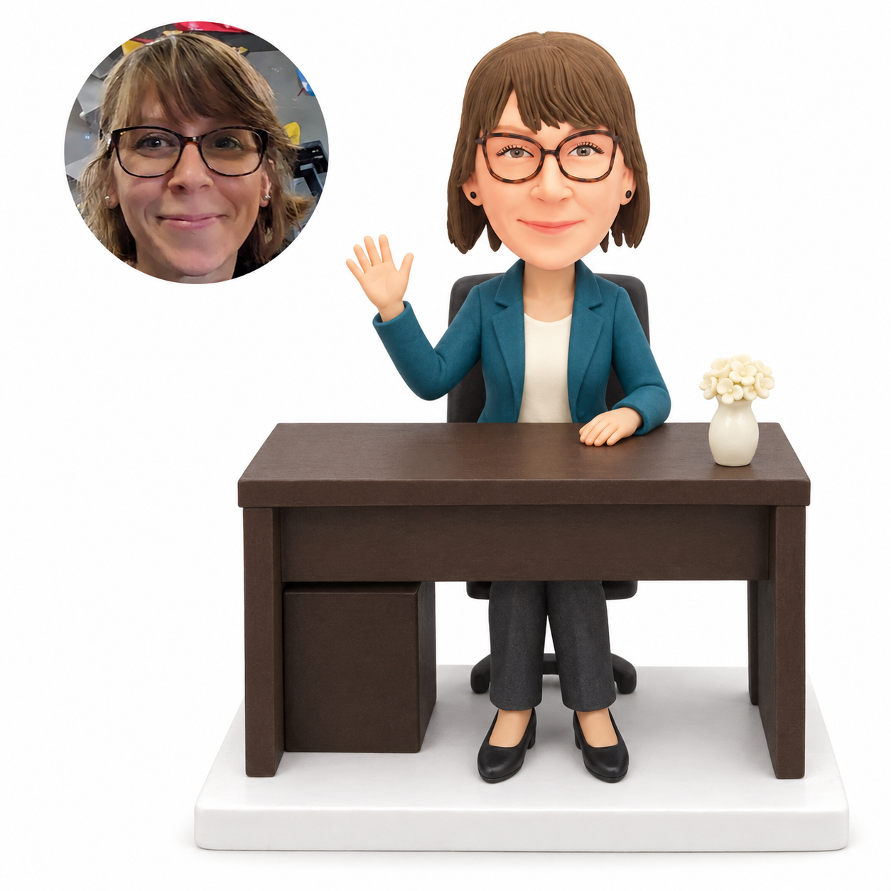 custom bobblehead figure businesswoman waving while seated at a desk with a flower vase