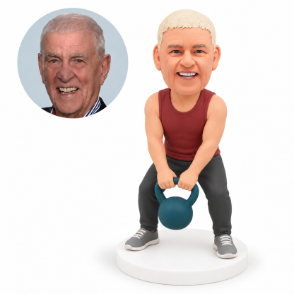 custom bobblehead figure man in gym trousers gripping a kettlebell below his waist with both hands