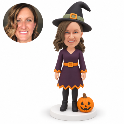 custom bobblehead figure woman in a witch dress and pointed hat with a jack-o-lantern beside her foot