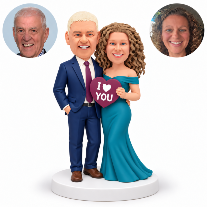 custom bobblehead figures couple with man keeping one hand in his pocket and an arm around the woman in a long gown holding an I Love You heart - MGA-AC1428