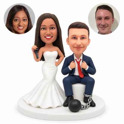 custom bobblehead figures standing bride beside a seated groom with a ball and chain around one ankle