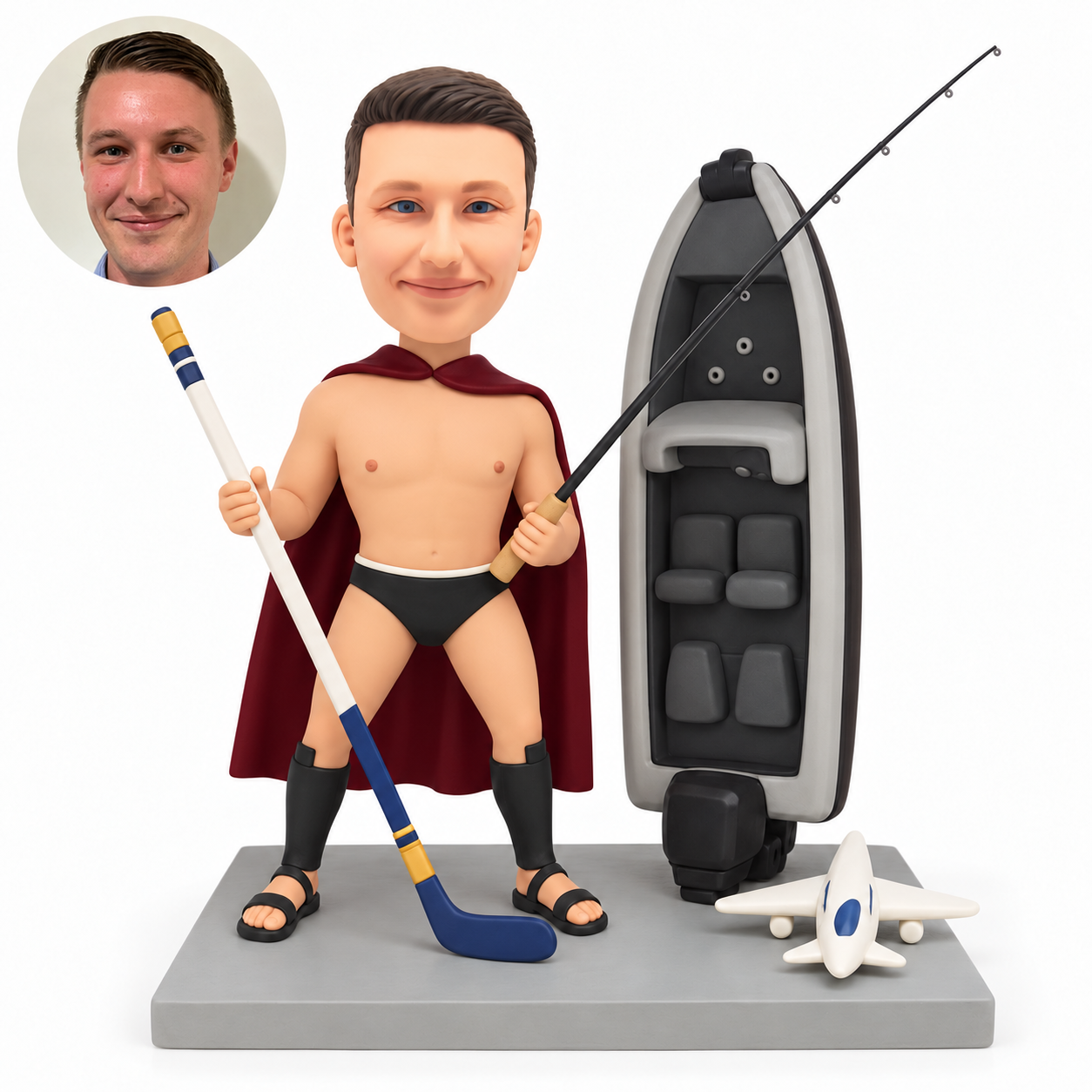 custom bobblehead figure caped male holding a hockey stick and fishing rod beside an upright motorboat and jet