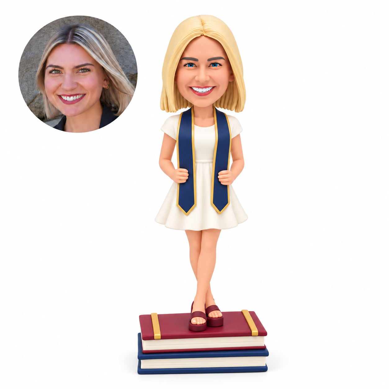 custom bobblehead figure female graduate in a short dress gripping her stole on stacked books
