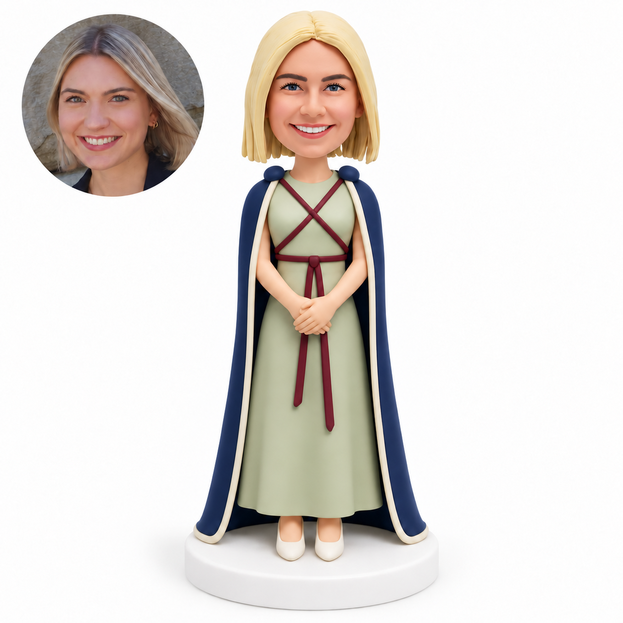 custom bobblehead figure female graduate in a long dress and floor-length cape with hands clasped