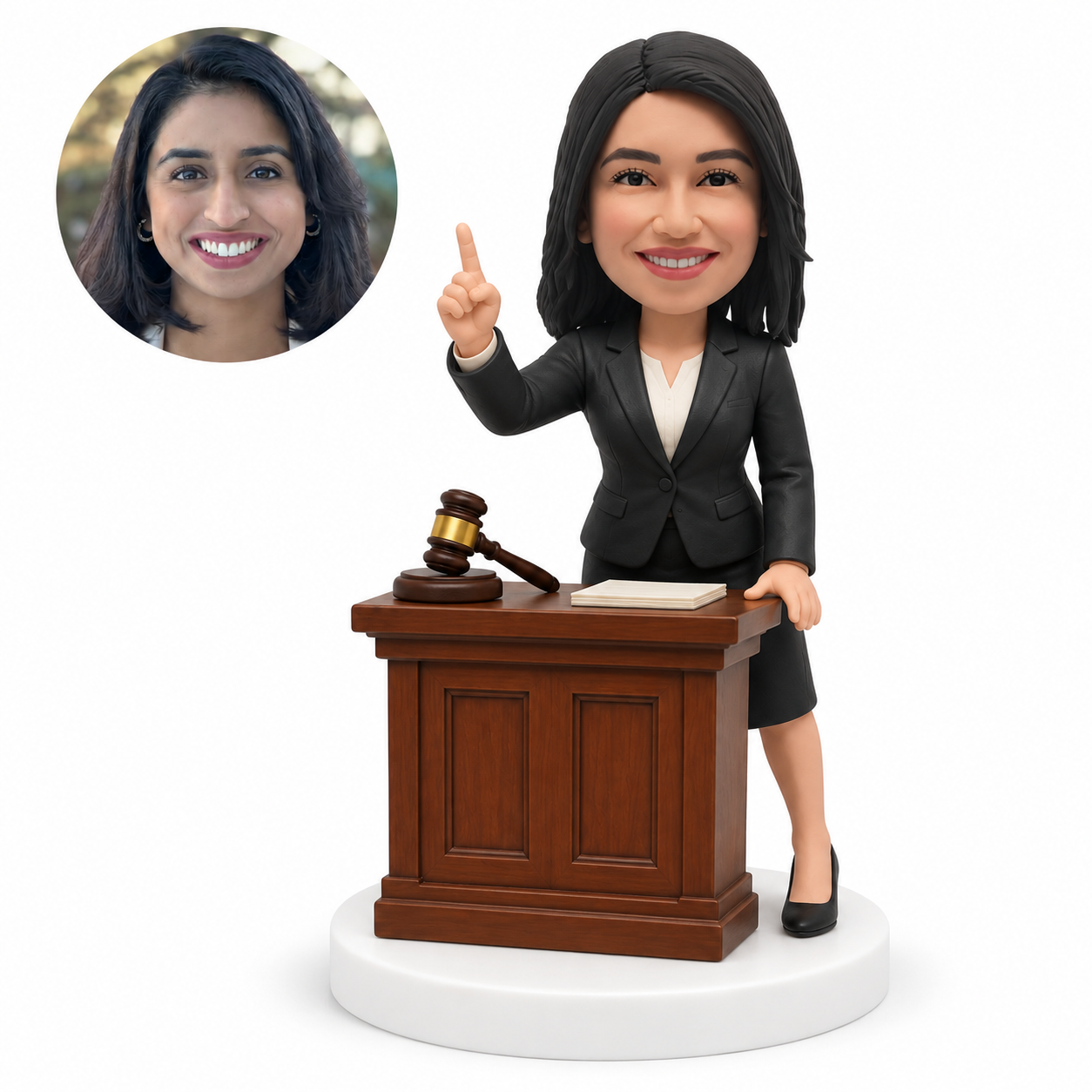 custom bobblehead figure female lawyer pointing upward behind a courtroom desk