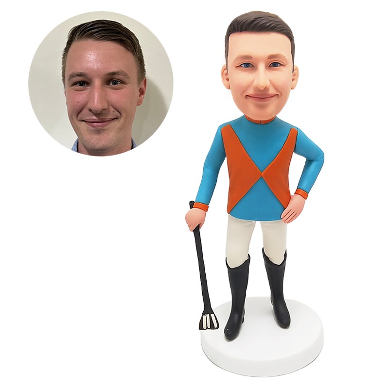 bobble head figurine man holding a tool
