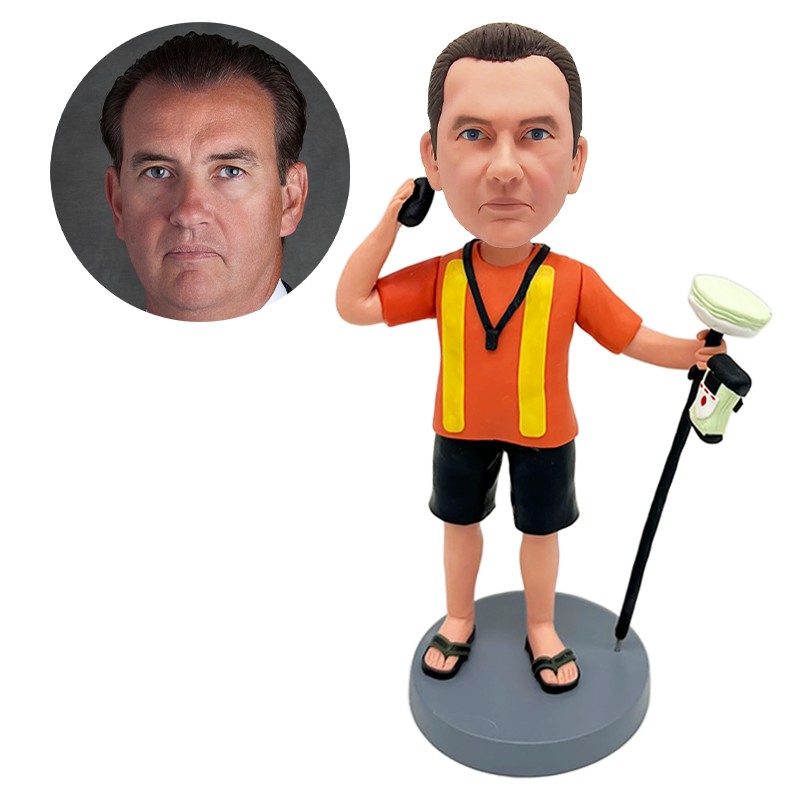 personalized bobblehead coach holding an annunciator