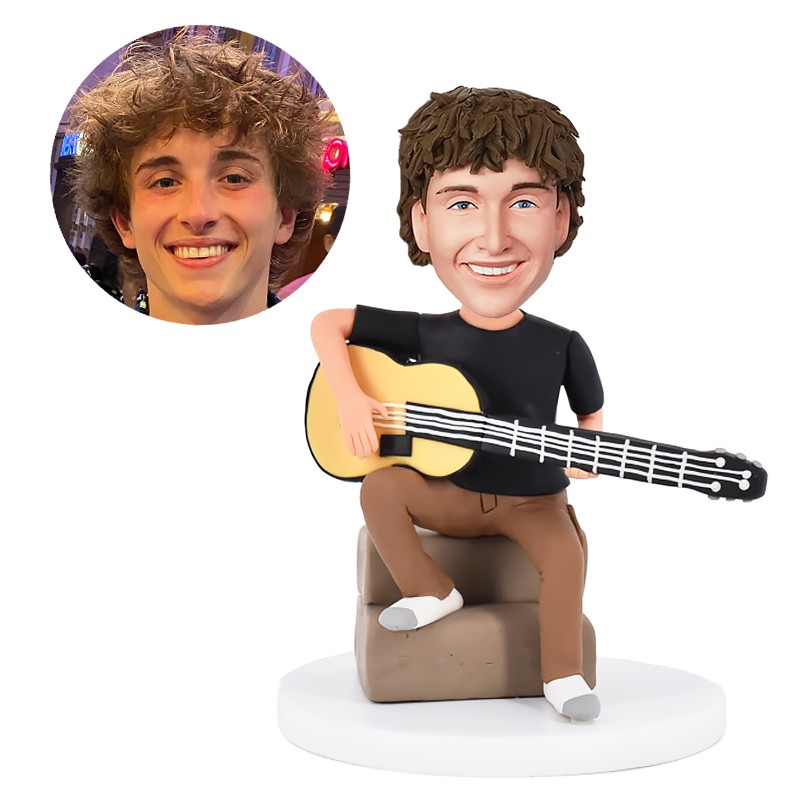 personalised bobble head musician holding a guitar