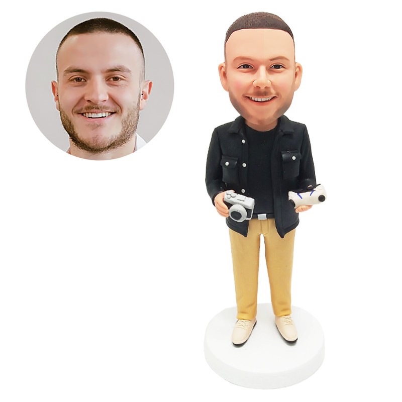 custom bobblehead figurine photographer holding a camera