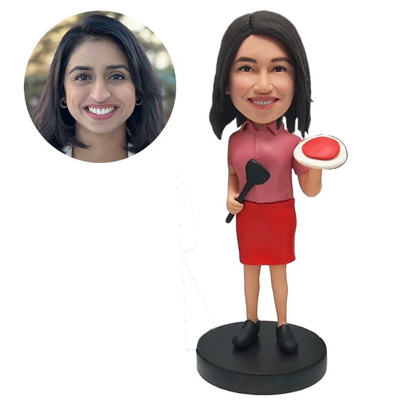 personalised bobble head cooker holding a turner