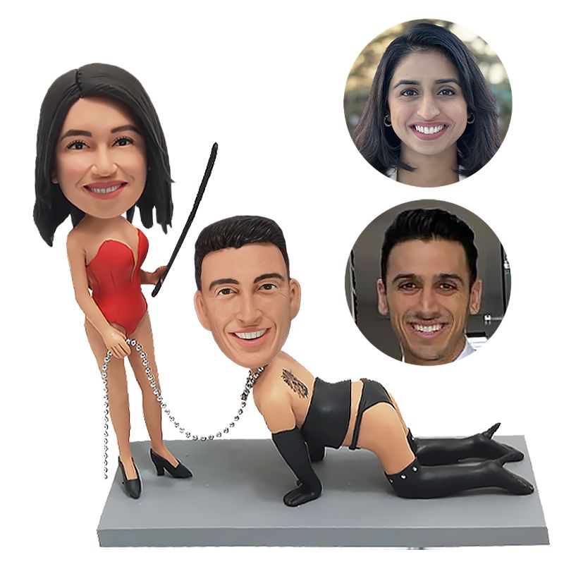 bobble head figurine playful couple with pigtail and chain