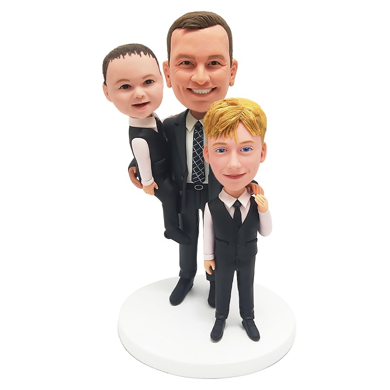 bobble head figurine father standing with two sons