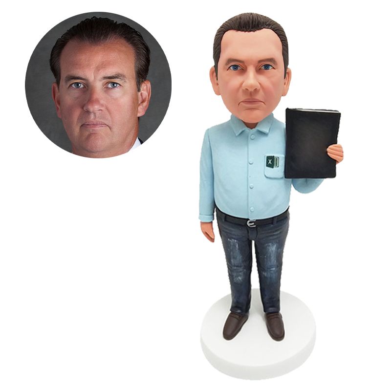 custom made bobblehead team member holding a notebook