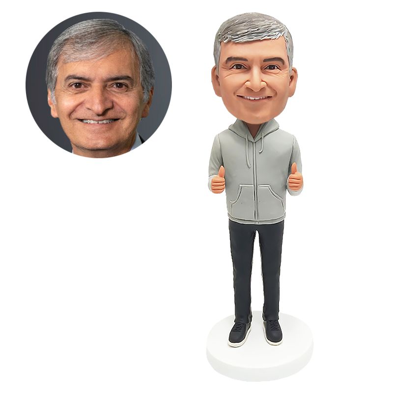 bobble head figurine man with thumbs up