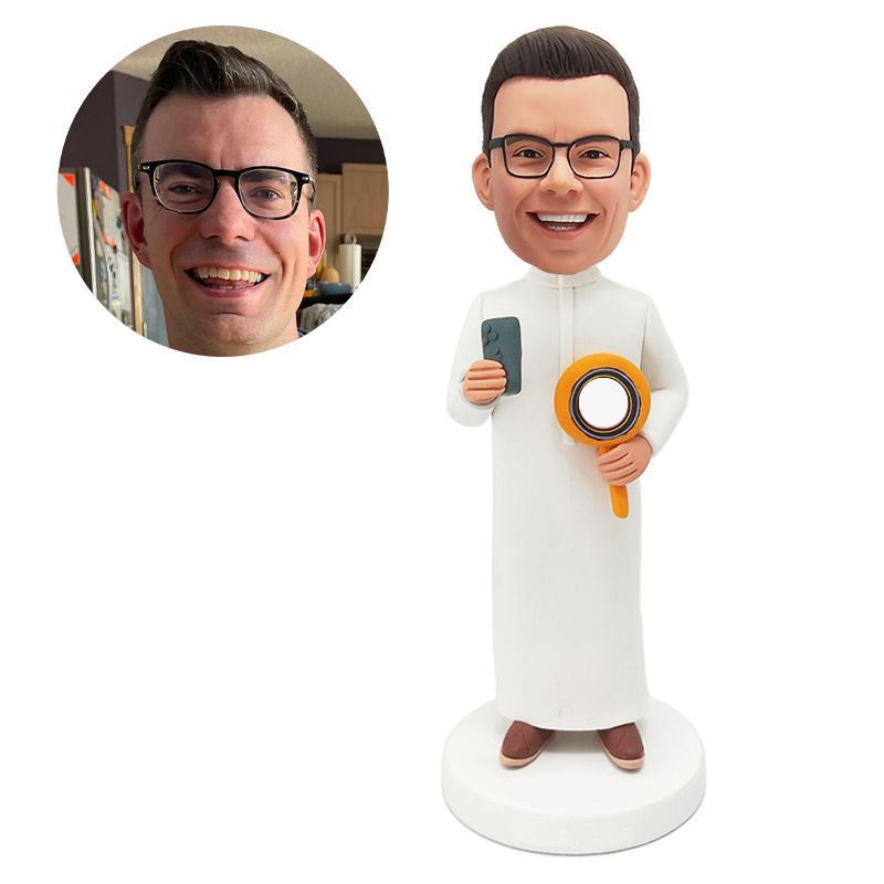 custom bobblehead figurine man holding a cell phone and a magnifying glass