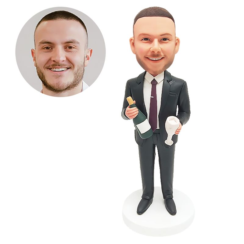 bobble head figurine man holding a red wine and a goblet