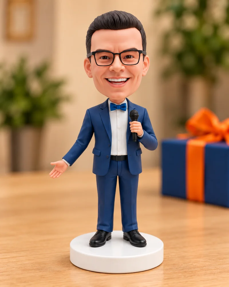 The finished navy-suited bobblehead with the customer’s personalised head and glasses.