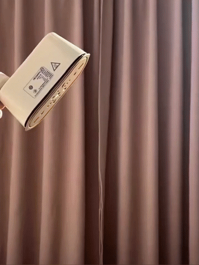 Small handheld ironing machine for home use