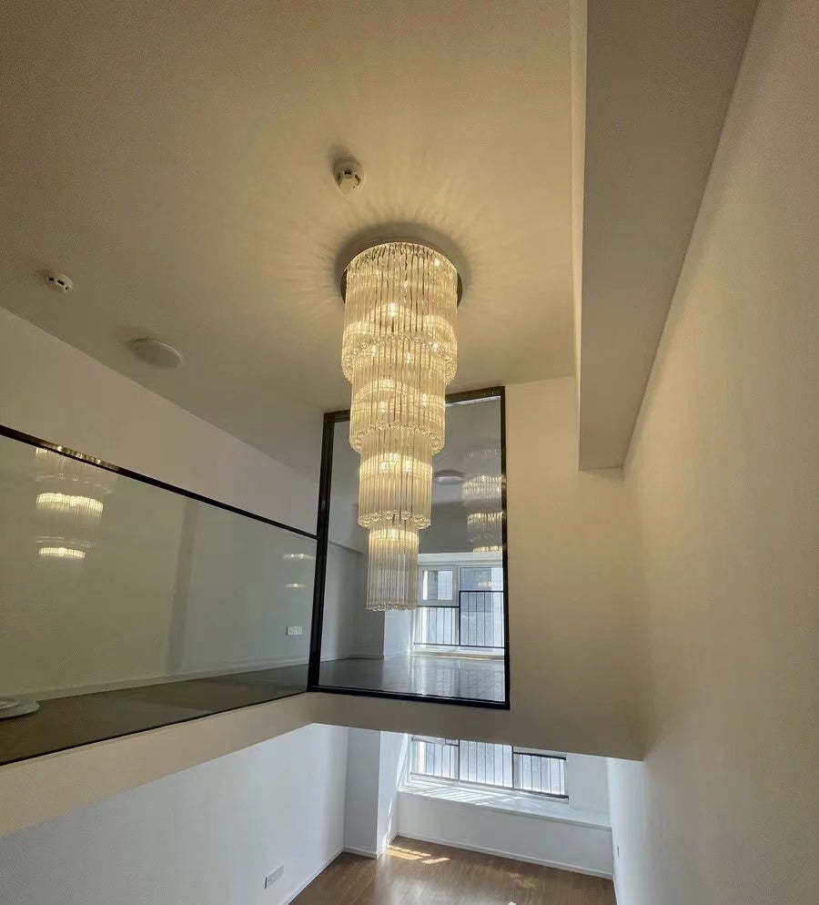 luxury, extra large, oversized,crystal, flush mount chandeliers, high-ceiling space,staircase, grand living room, duplex, luxurious 2-floor loft, entryway, deluxe, foyer and hotel lobby.