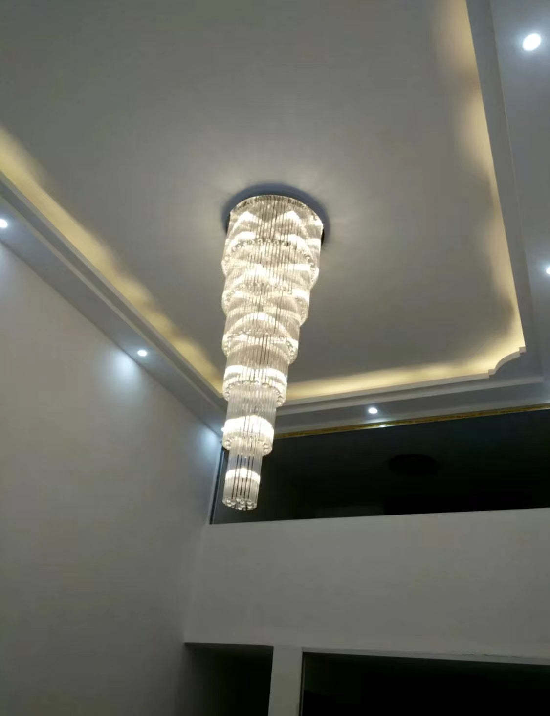 luxury, extra large, oversized,crystal, flush mount chandeliers, high-ceiling space,staircase, grand living room, duplex, luxurious 2-floor loft, entryway, deluxe, foyer and hotel lobby.