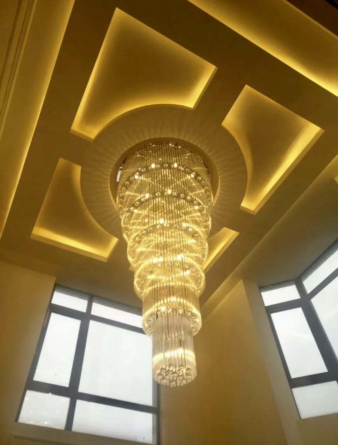 luxury, extra large, oversized,crystal, flush mount chandeliers, high-ceiling space,staircase, grand living room, duplex, luxurious 2-floor loft, entryway, deluxe, foyer and hotel lobby.