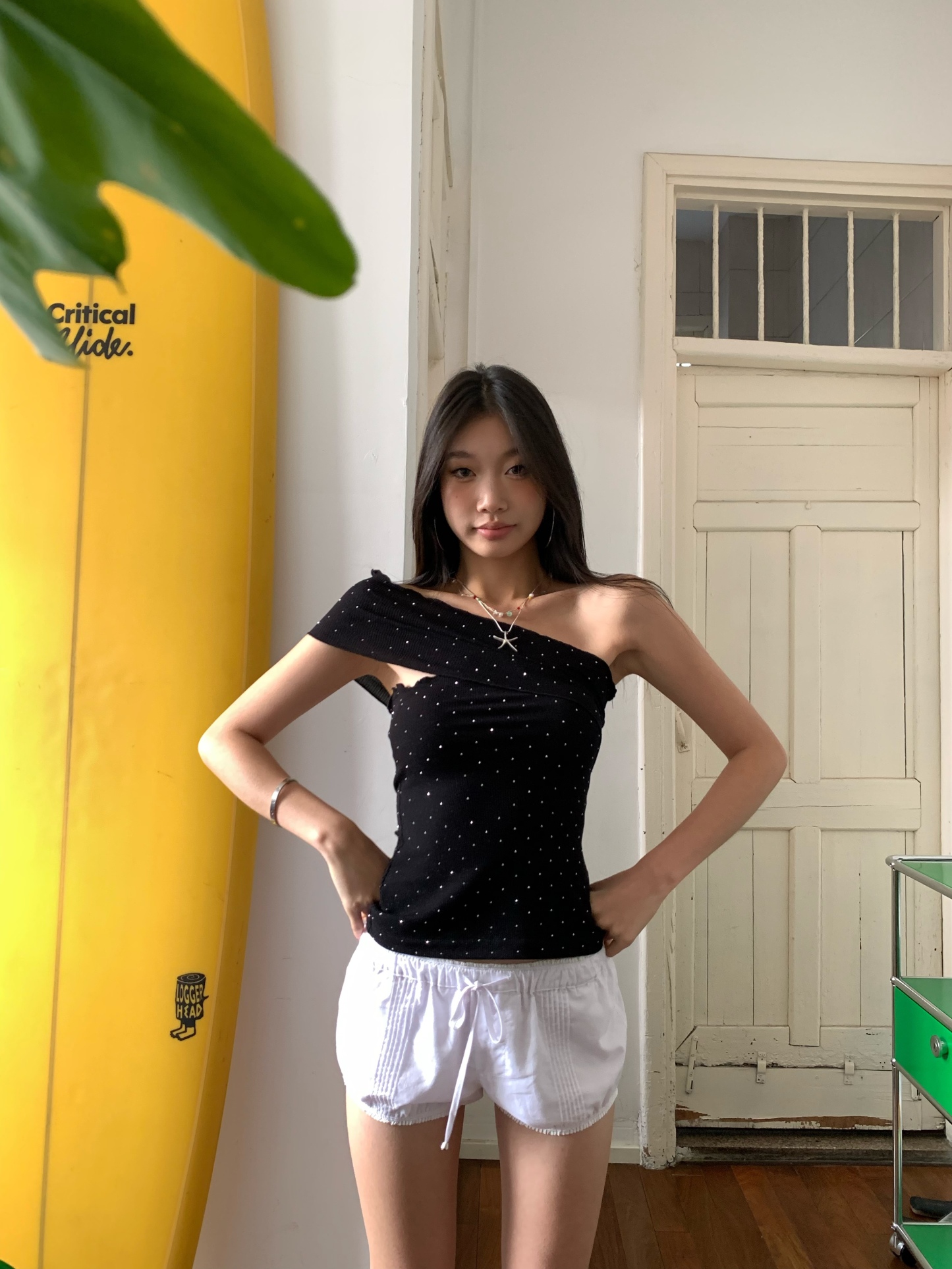 Black one-shoulder crop top with polka dots