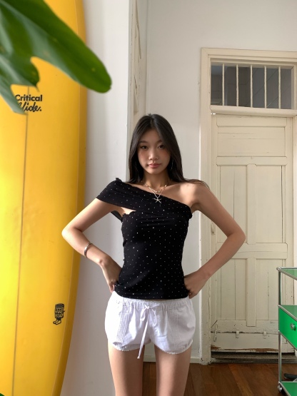 Black one-shoulder crop top with polka dots