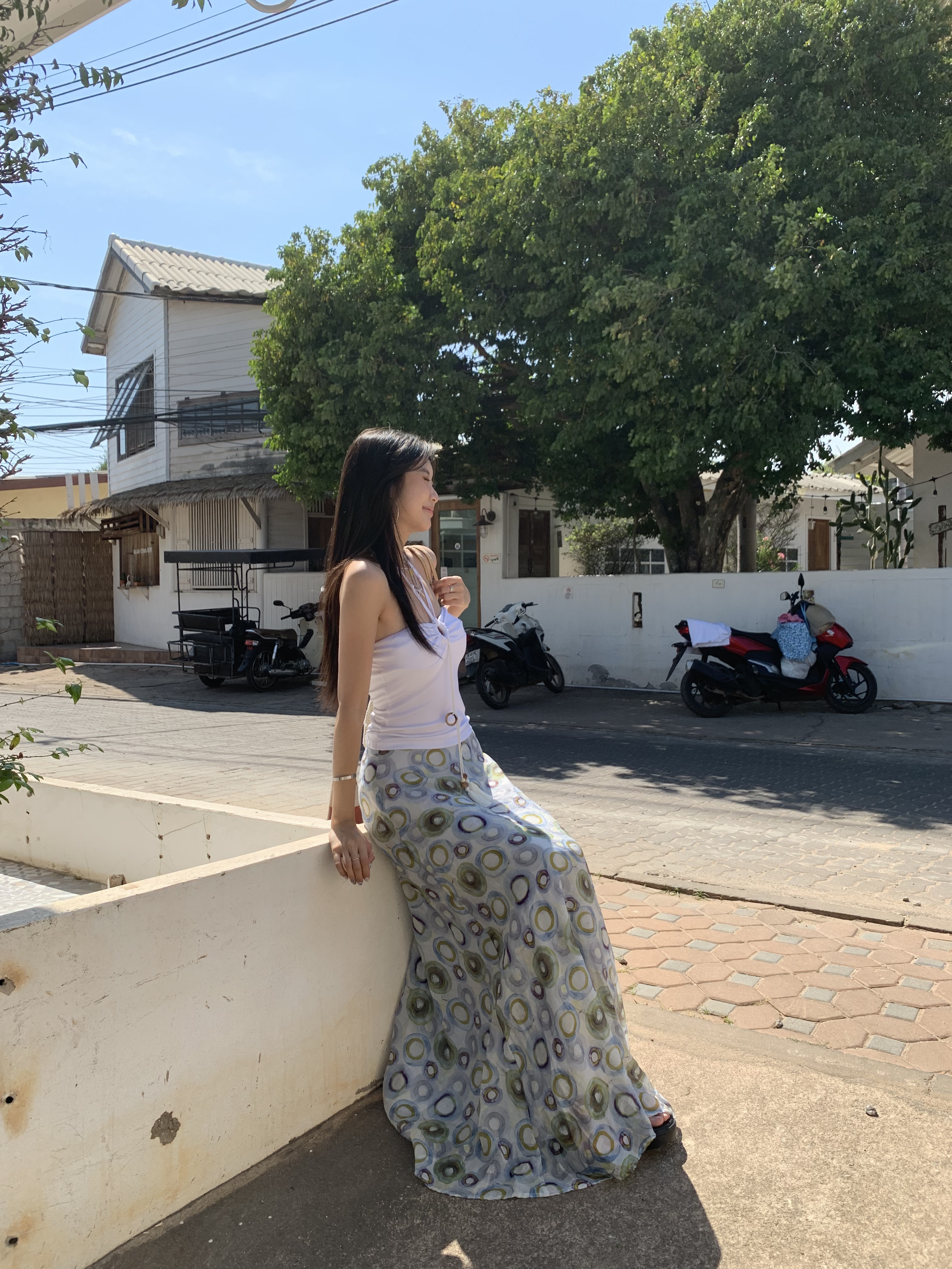 A fitted halter neck top that can be worn as a bra or on its own for a fresh summer look