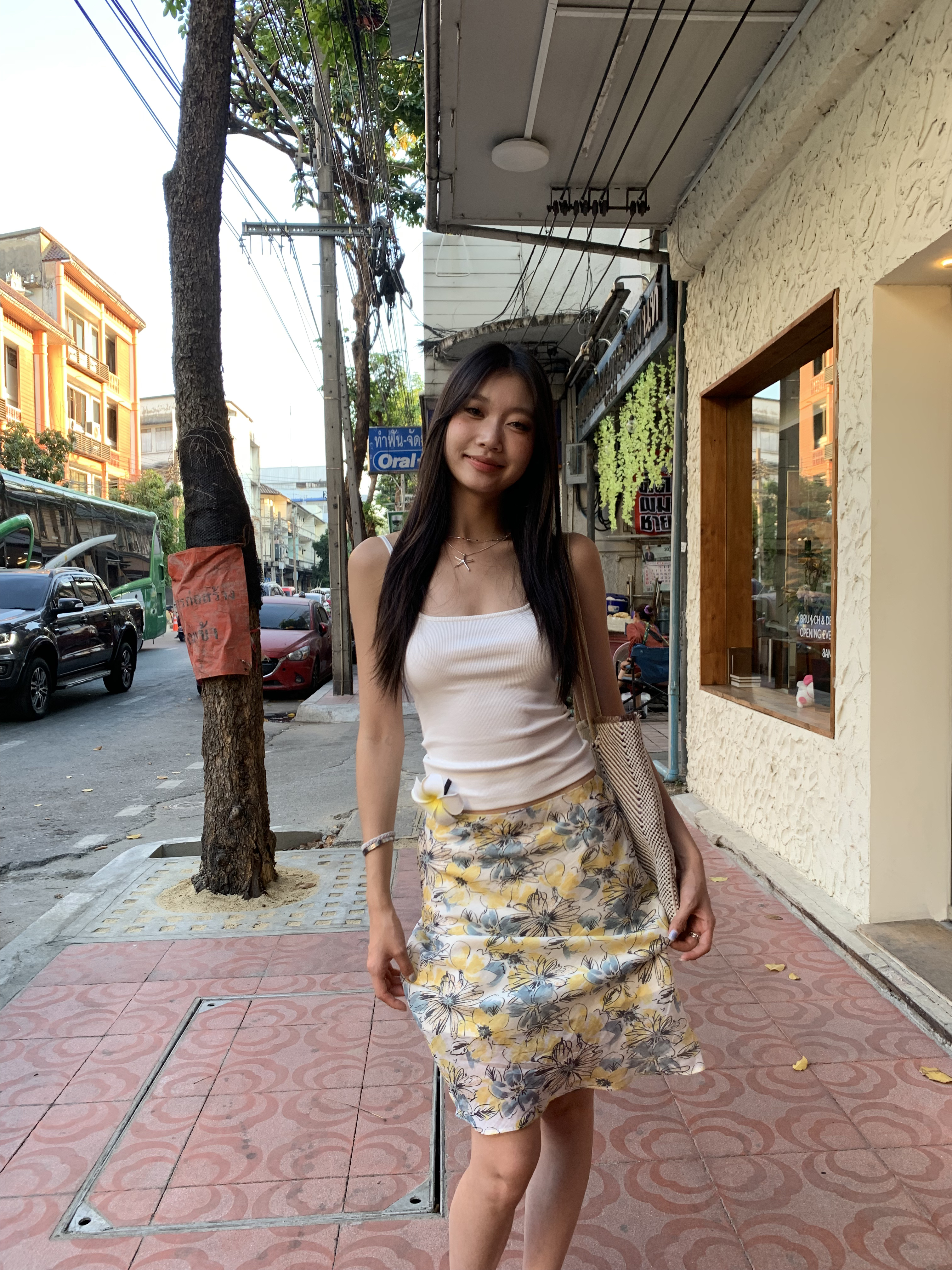 Mid-length skirt with ruffled edge design and multi-colored floral print