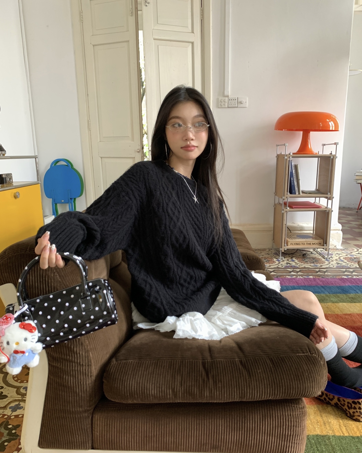 Women's knitted sweater with spiral pattern
