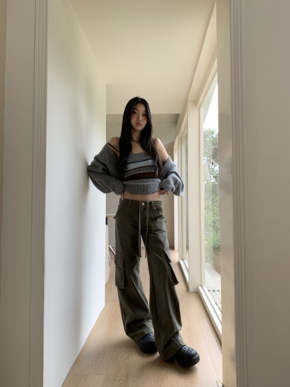 Vintage low-rise cargo pants with multiple pockets and a wide, straight leg.