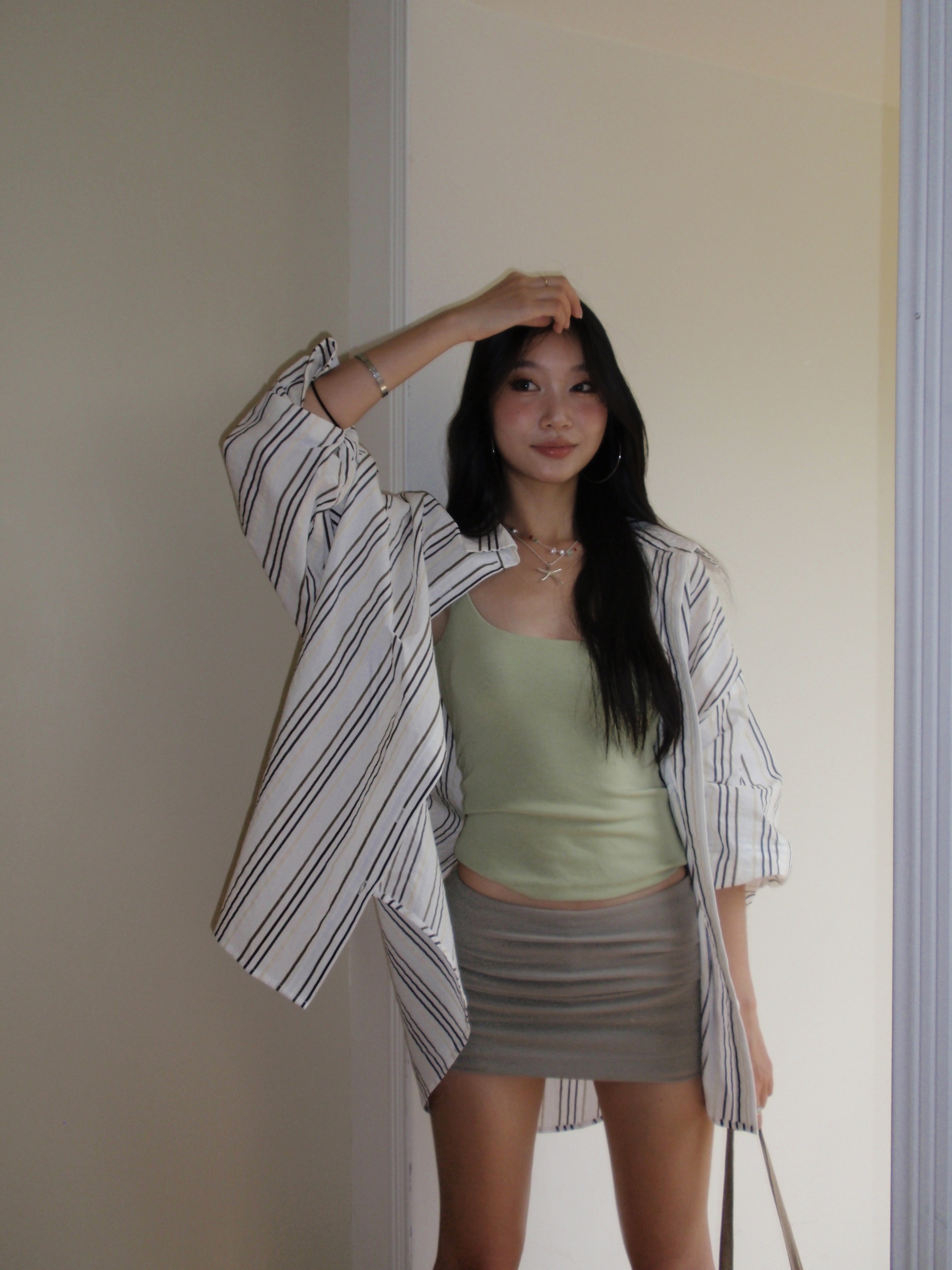 Green spaghetti strap top in a sexy style. Wear it as an inner shirt or wear it alone and it will look good.
