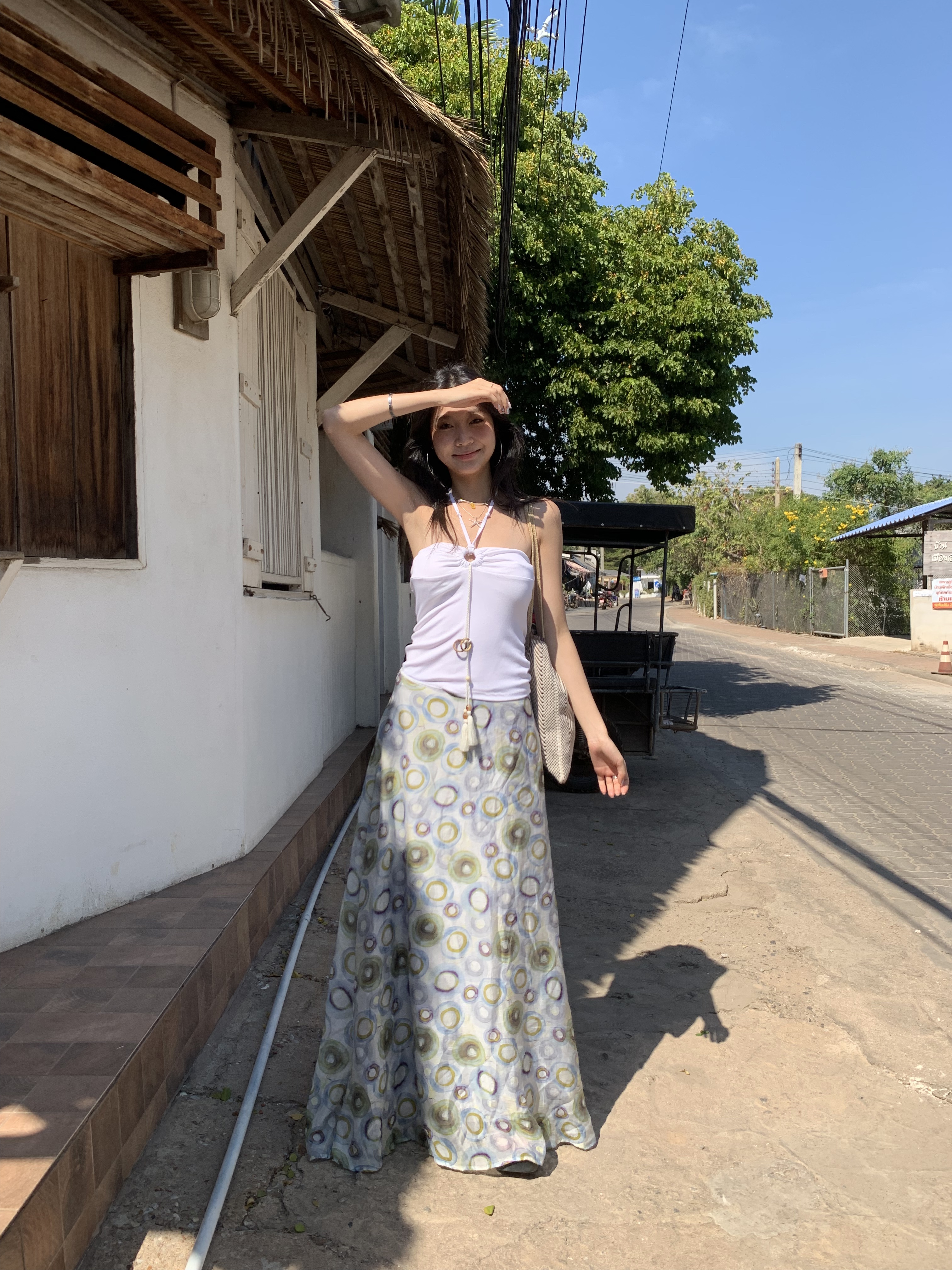 A fitted halter neck top that can be worn as a bra or on its own for a fresh summer look