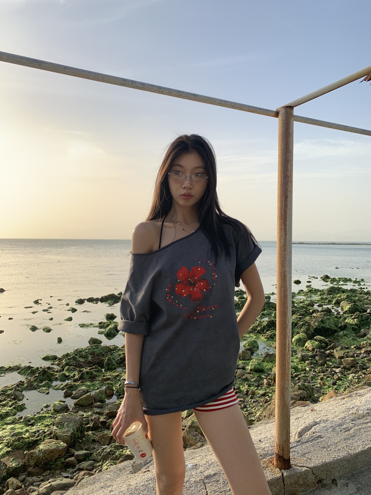 Loose fit hibiscus floral top with one shoulder cutouts