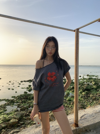 Loose fit hibiscus floral top with one shoulder cutouts